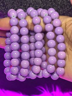 Royal Arm Candy Individual Bracelets feature 8mm or 10mm beads, making it the ideal accessory to adorn your arm and amplify its allure. What do you get: 1 bracelet Fits a 7" wrist but can stretch bigger 10mm beads Purple Beaded Bracelets With Large Beads, Purple Beaded Bracelet With Large Round Beads, Purple Stretch Bracelet With Spacer Beads, Purple Stretch Bracelet With Spacer And Round Beads, Purple Stretch Bracelet With Large Round Beads, Hypoallergenic Rosary Bracelet With Round Beads, Adjustable Stretch Bracelet With 8mm Beads, Adjustable 8mm Beaded Stretch Bracelet, Purple Bracelets With Large Beads