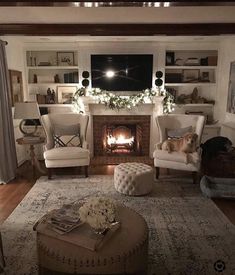 a living room filled with furniture and a fire place in the middle of the room