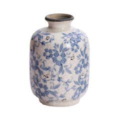 a blue and white vase with flowers on it's side, against a white background