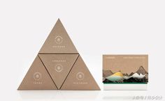 the packaging is designed to look like three pyramids with mountains in the background and below