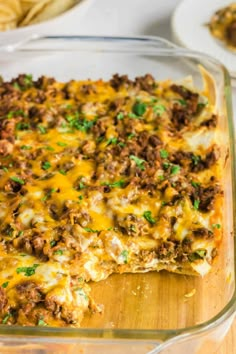 a casserole dish filled with ground beef and cheese