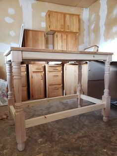 an unfinished kitchen island in the process of being built