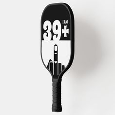 a black and white paddle with the number fifty five on it