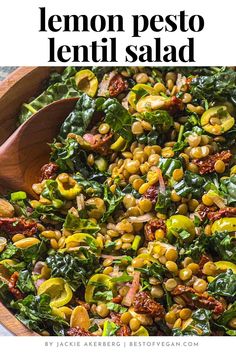 a wooden spoon in a bowl filled with lemon pesto lentil salad