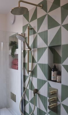 the shower head is attached to the wall