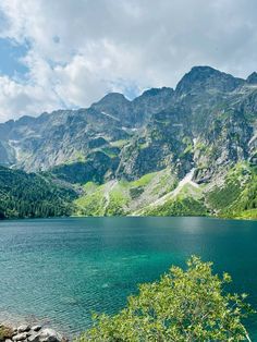 a lake surrounded by mountains and trees