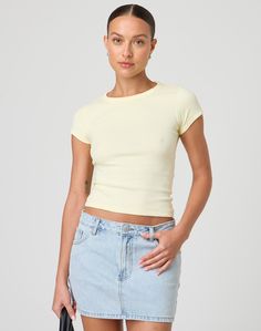 This top is a neccessary basic with a crew neckline and fitted baby tee style. Basic Short Sleeve Top For Spring, Basic Everyday Tops With Scoop Neck, Basic Fitted Cropped T-shirt, Trendy Crew Neck Tops For Everyday, Basic Scoop Neck Tops For Everyday, Trendy Everyday Crew Neck Tops, Spring Crew Neck Cropped T-shirt For Everyday, Everyday Crew Neck Cropped T-shirt For Spring, Spring Everyday Crew Neck Cropped T-shirt