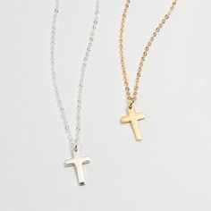 DESCRIPTION Our most popular and delicate CROSS necklace, shiny and minimal, complements your look. Wear it every day, all day long, and never take it off ✞DETAILS• Chain Type : Dainty and sparkly cable chain• Chain material : Sterling Silver• Chain Length : 18"• Cross Length : 10mm• Cross material : Sterling Silver Minimalist Cross Pendant Necklace With Adjustable Chain, Minimalist Sterling Silver Charm Necklaces, Everyday White Gold Clavicle Chain Charm Necklace, Minimalist Jewelry With Cross Pendant Clavicle Chain, Everyday White Gold Clavicle Charm Necklace, Minimalist Sterling Silver Charm Necklaces, Tarnish Resistant, Minimalist Clavicle Chain Jewelry With Cross Pendant, Minimalist Sterling Silver Charm Necklace Tarnish Resistant, Minimalist Sterling Silver Charm Necklace, Tarnish Resistant