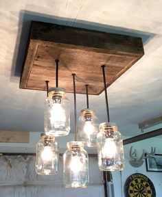 mason jar chandelier hanging from the ceiling