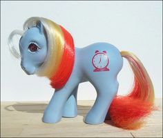 a toy pony with red, yellow and blue hair