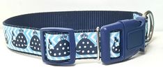 a blue and white dog collar with ladybugs on it's front side