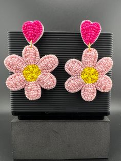 This is a beautiful Quirky beaded Earrings in Magenta and Pink Flower design. Very light weight to wear and looks good on any attire. This is very beautiful to look at and a perfect one for regular wear and also parties.  Color : Magenta, Pink, Yellow length : 2.75 inch width : 1.75 inch Each earring Weight : 6.8 grams Material : Beads, Fabric Beautiful High Quality, premium jewelry. Free US standard shipping. Hand crafted in India with the finest design, this earring is of premium quality and u Pink Flower Design, Beads Fabric, Magenta Flowers, Boho Earring, Premium Jewelry, Quirky Earrings, Beaded Earring, Color Magenta, Earring Handmade