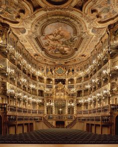 an ornately decorated auditorium with chandeliers