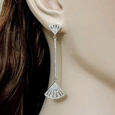 "A pair of long lightweight linear dangle cz bridal earrings featuring Gatsby wedding style Art Deco geometric fan shape posts and dangle. This limited edition jewelry is made of sparkly clear cubic zirconia with white gold silver rhodium plated frames. Earrings are about 2 1/2\" (6.5cm) with posts. View matching pieces or similar designs at https://etsy.me/2UncS3p See all geometric designs at https://etsy.me/2eKf6s8 View all earrings at https://etsy.me/1f8VFT4" Silver Art Deco Drop Bridal Earrings, Silver Art Deco Bridal Drop Earrings, Silver Teardrop Art Deco Earrings, Nickel-free Dangle Earrings In Art Deco Style, Nickel-free Dangle Art Deco Earrings, Art Deco Geometric, Gatsby Wedding, Geometric Wedding, Wedding Jewelry Earrings