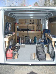 the inside of a white van with tools and equipment in it's storage area