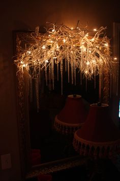 a mirror with some lights hanging from it