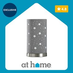 an image of a night light with stars on it and the words at home below