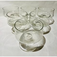 a bunch of wine glasses sitting on top of each other