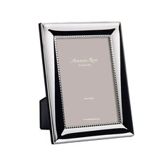 a silver and black frame with an inscription on it