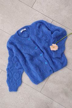 "Alpaca and silk openwork woman cardigan with shell buttons.  Warm and soft-touch it will be perfectly for a your basic outfit!  Very delicate and feminine, it will complement any of your outfits and make it chic. Product Details: * 75% alpaca, 25% silk Size S:  Width : 46/48 cm Length: 56 cm Size M:  Width : 50/52 cm Length: 60 cm  Size L:  Width : 54 cm Length: 60 cm Size XL:  Width : 56/58cm Length: 65 cm If you would like me in other size, you could request a custom order with your own param Elegant Hand Knitted Winter Cardigan, Elegant Hand Knitted Long Sleeve Cardigan, Elegant Fitted Mohair Cardigan, Elegant Long Sleeve Hand Knitted Cardigan, Elegant Blue Winter Cardigan, Elegant Mohair Cardigan For Spring, Elegant Mohair Cardigan, Elegant Spring Mohair Cardigan, Elegant Hand Knitted Fall Outerwear