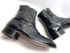 VERY HANDSOME COSPLAY OR EVERYDAY BOOTS. BLACK LEATHER FLORSHEIM DISCO DRESS BOOTS. NEAR NEW CONDITION IMPECCABLY CLEAN.  READS A MENS SIZE 10 3E INSIDE THE BOOTS. LOOKS LIKE IT READS 13 3E BUT IT IS A 10 3E. I MADE SURE BY MEASURING THEM AGAINST SOME OTHER SIZE 10 FLORSHEIM BOOTS I HAVE AND THEY ARE THE SAME LENGTH AS A 10.  I BELIEVE THESE ARE FROM THE 90's. 70's STYLE JOHN TRAVOLTA SATURDAY NIGHT FEVER THE BEATLES RETRO DISCO LEATHER BOOTS.  VERY GENTLY WORN IMPECCABLY CLEAN CONDITION. LOOKS Fitted Black Chelsea Ankle Boots, Vintage Black Heeled Boots With Snip Toe, Black Vintage Heeled Boots With Snip Toe, Vintage Black Chelsea Boots With Round Toe, Vintage Black Leather Chelsea Boots, Vintage Black Heeled Boots For Formal Occasions, Retro Black Ankle Boots, Retro Fitted Black Heeled Boots, Fitted Vintage Boots For Business