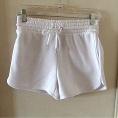 If It Were Me White High Rise Elastic Waist Sweat Shorts. Has Pockets On The Sides. Size Small. Never Worn. Casual, Athleisure, Wardrobe Staple, Basic, Trendy. Great For Going To The Gym, Doing Yoga, Or Every Day Wear. Waist - 13 Inches Rise - 11 Inches Inseam - 3 1/2 Inches White Fitted Pajama Shorts, White Stretch High-waisted Pajama Shorts, White Pajama Shorts With Elastic Waistband, White Drawstring Pajama Shorts For Spring, White Spring Pajama Shorts, White Drawstring Shorts For Loungewear, Casual White Pajama Shorts With Drawstring, White High-waisted Drawstring Shorts, Casual White Drawstring Pajama Shorts