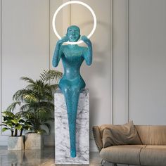 there is a blue statue in the middle of a room