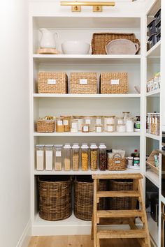 an organized pantry with baskets and food items