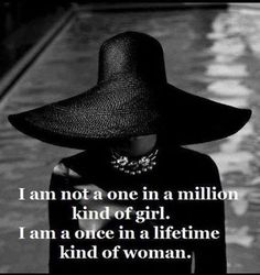 a woman wearing a large black hat with the caption i am not a one in a million kind of girl