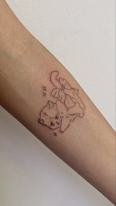 a person with a cat tattoo on their arm