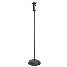 a black metal pole with three stars on the top and one star on the bottom