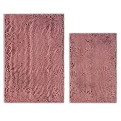 two pink rugs on white background, one is made out of snakeskind fabric