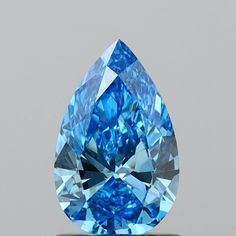 a blue diamond is sitting on top of a table