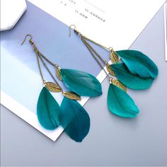 Beautiful, Lightweight Feather Earrings Made Of Alloy And Feathers With Hook Length Is 6.1 Inches Fyi- The Mannequin In 2nd Photo Is Smaller Than A Human Head And Is Showing How They Lay Teal Color Fake Earrings, Woman In Gold, Earrings Feather, Fairy Accessories, Teal Earrings, Alloy Earrings, Tassel Drop Earrings, Colorful Feathers, Summer Earring