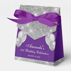 an elegant purple and silver birthday party gift bag with a bow on the front that says, amanda's 1st birthday celebration