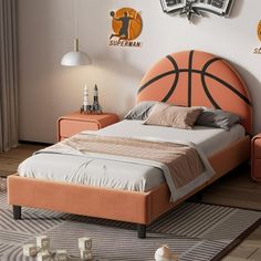 a basketball themed bedroom with orange bedding