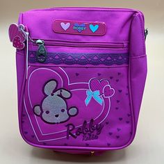 A Vintage Nwt Rare Robby Rabbit Purse, Bag Small Backpack For Sale. This Item Is In Awesome Condition. There Are Mild Signs Of Age And Use.Please See Photos Clearly.Any Questions? Please Ask. This Item Is From A Smoke-Free And Pet-Free Household. Purple Backpack With Zipper Closure, Purple Pouch Shoulder Bag For School, Purple School Bag With Mobile Phone Pocket, Purple Travel Bag With Adjustable Handle, Purple Bag With Adjustable Strap For Back To School, Purple Mobile Phone Bag For School, Back To School Purple Bag With Adjustable Strap, Purple Back To School Bag With Adjustable Strap, Purple School Bag With Removable Pouch