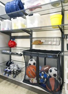 there are many sports balls and toys in the storage area