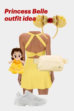 the back of a woman's yellow dress with an image of a doll