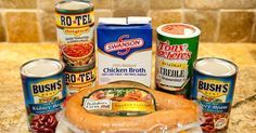 canned foods are arranged on a counter top