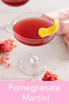 the pomegranate martini is garnished with a lemon wedge