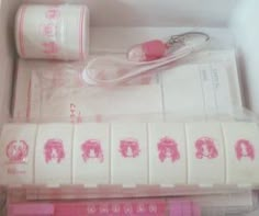 an open box with some pink items in it