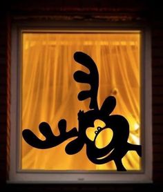 the silhouette of a cartoon character in front of a window