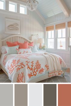 a bedroom with white walls and orange accents