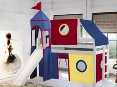 a child's play house with a slide and climbing tower in the middle of it