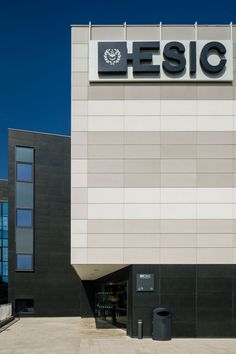 a large building with a sign on the side of it that says, essic