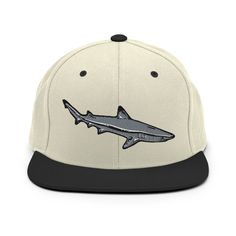 "Reef Shark Snapback Hat, Shark Embroidery, Reef Black tip Shark, Coral Life Hat, Reef Shark, Divers gift, Diving Design, Reef Souvenir  Plum & Pepper Reef Shark Design. \"Sideview of a hunting black tip grey reef shark\" Our Snapback Hat is made from a premium wool blend with a flat visor. All Colour options hide a vivid accent--a green undervisor and a funky Plum & Pepper Embroidery Design. * 80% acrylic, 20% wool* Soft, unstructured crown, curved visor * Structured, 6-panel, high-profile * 6 Embroidered Black Hats As Gifts, Custom Embroidered Adjustable Flat Bill Baseball Cap, Adjustable Flat Bill Baseball Cap With Custom Embroidery, Custom Embroidered Adjustable Snapback Hat, Adjustable Flat Bill Hat With Custom Embroidery, Embroidered Flat Bill Fitted Hat, Black Baseball Cap With Custom Embroidery, Black Cap With Custom Embroidery, Pepper Embroidery