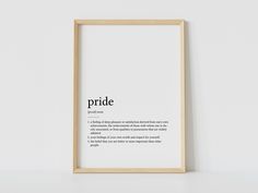 a white framed poster with the words pride printed on it in black and white font