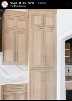 a kitchen with wooden cabinets and white tile counter tops in the background is an unfinished wall