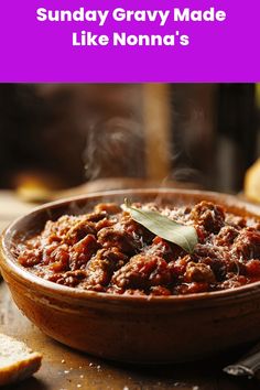 A steaming bowl of traditional Italian Sunday gravy (meat sauce) garnished with a bay leaf, featuring tender chunks of braised meat in a rich red tomato sauce, served in a rustic terracotta bowl. Steam rises from the hot sauce, and grated cheese is visible on top. Sunday Gravy, Gravy